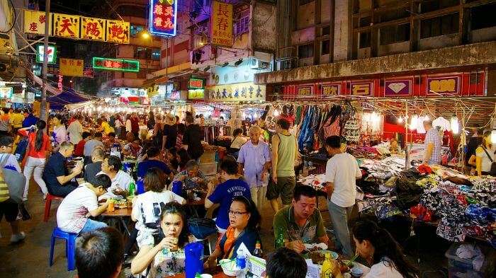 Tourists exploring the nightlife in Bali with a crazy shopping experience in Kuta Market