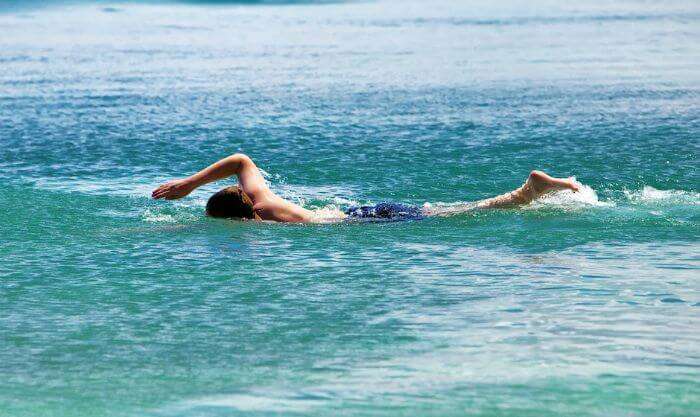 An enthusiastic swimmer enjoying swimming at La Cambuse