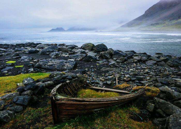 Remains of a boat on the beautiful Stokksnes Beach in South East Iceland