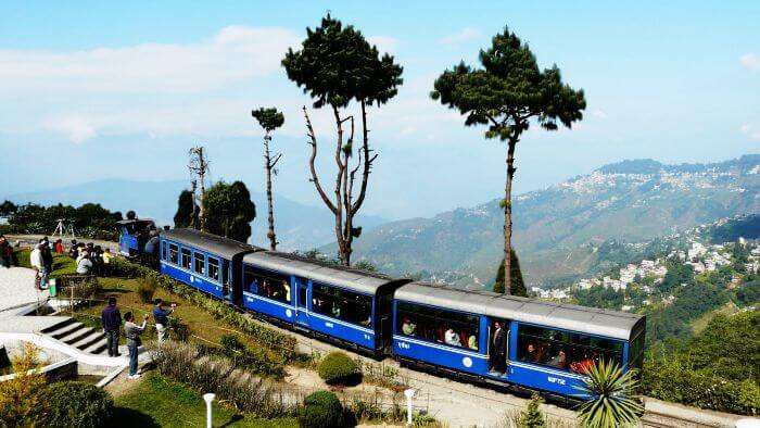 Tourists clicking pictures of the toy train from New Jalpaiguri to Darjeeling