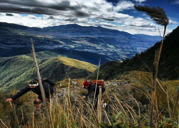 Two girls trekking Pasochoa Summit in Quito of Ecuador