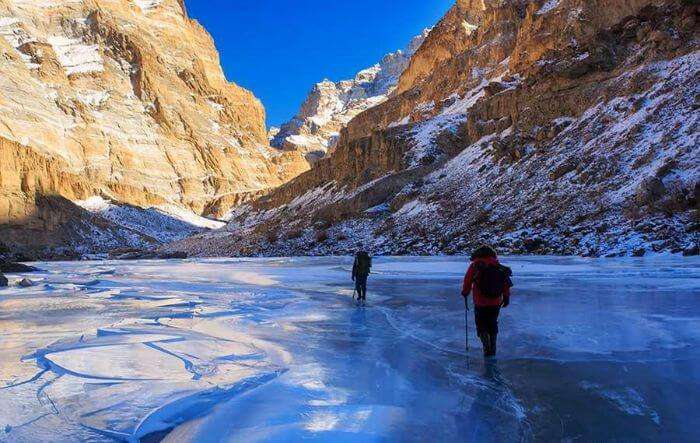 Trekkers walk on the ice sheet during Chadar trek
