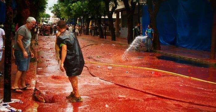 The locals wash the street after the Tomatina fight ends
