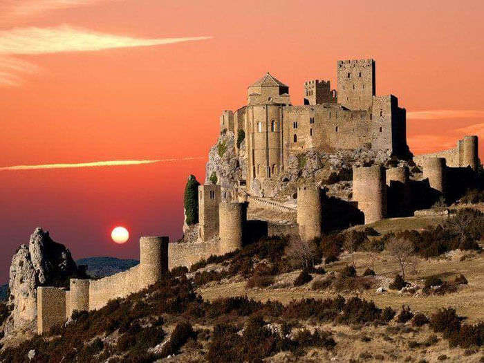 Sun sets down at a castle in Huesca