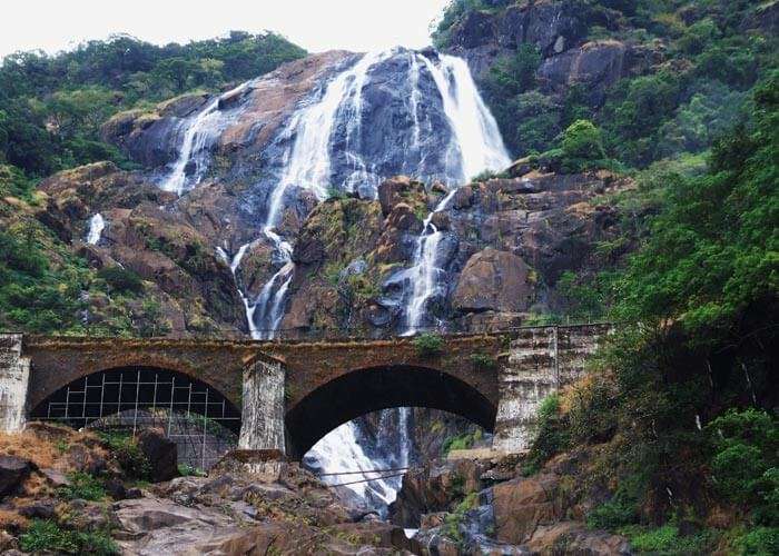 The railway bridge in front of the majestic Dudhsagar falls in Goa