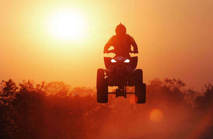 A rider leaps on the track
