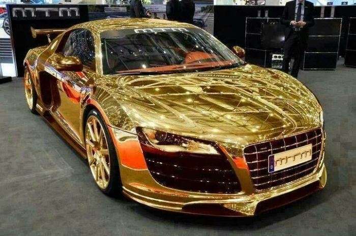 A gold plated boutique car on display