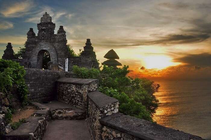 Sunset view at the hilltop Puru Luhur Uluwatu temple in Bali