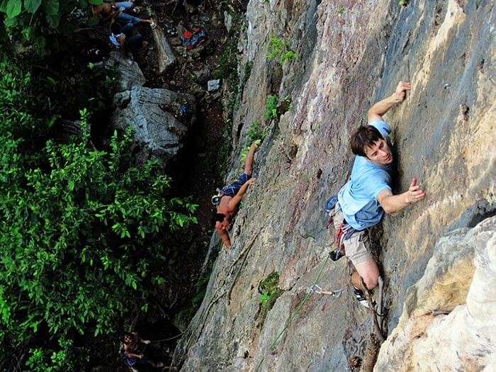 Rock climbing at Batu caves - an adventurous spot among all the top places to visit in Malaysia