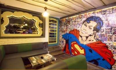 The Superman photo wall inside the Superhero Café