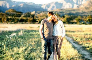 A couple enjoying a romantic walk at Franschhoek - the perfect honeymoon destination in South Africa