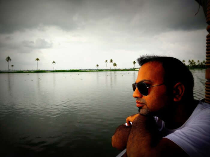 Rahul enjoying the view of backwaters from his Alleppey Boathouse