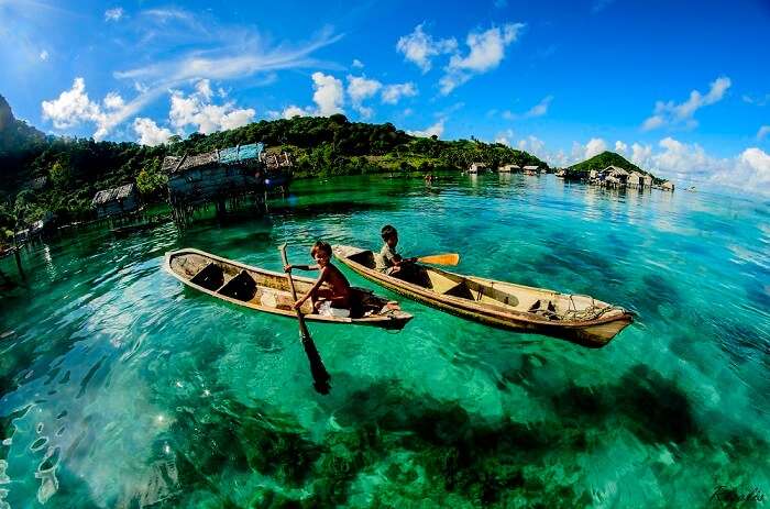 Children kayaking at the Mabul Island