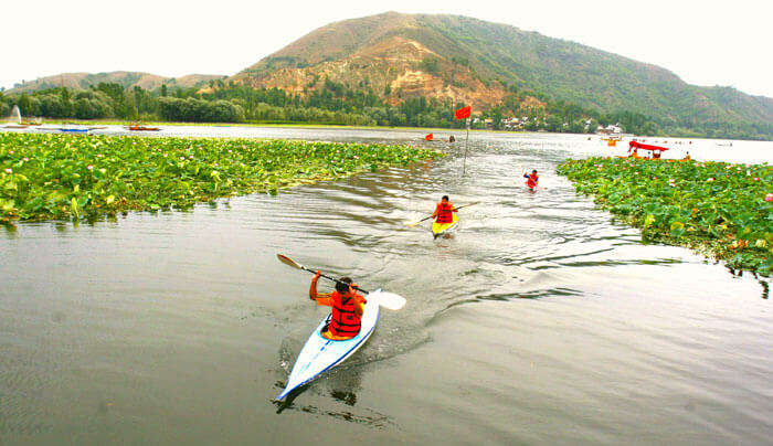 People kayaking at Manasbal Lake in Jammu & Kashmir