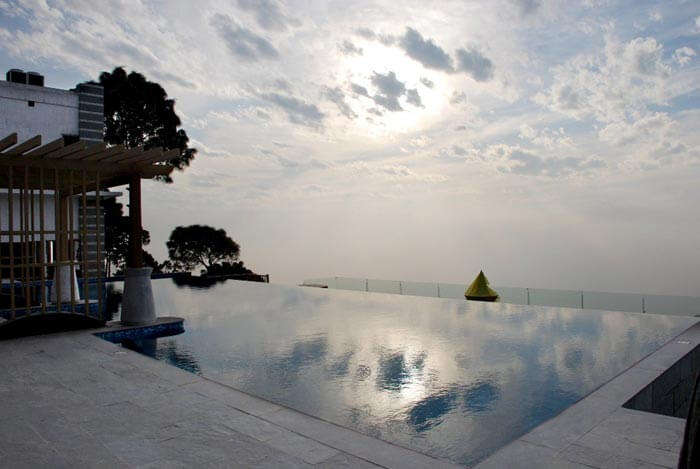 Breathtaking view from the pool at Moksha Himalaya Spa Resort - a fine luxury resort near Chandigarh