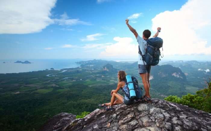 A traveler couple connecting with nature rather than laptops