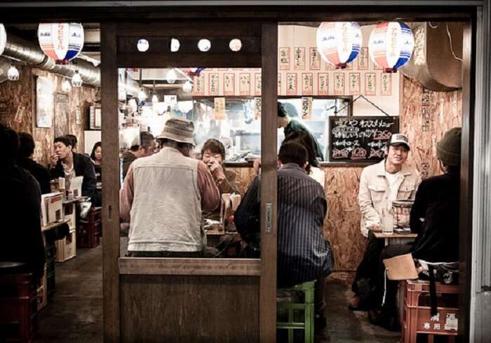 Few travelers trying food at a local outlet