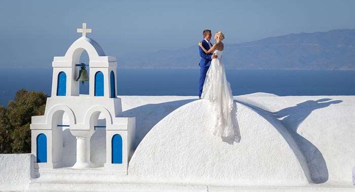 A couple in the city of Santorini, Greece