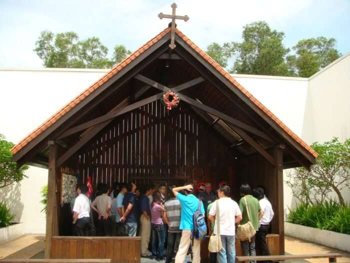 Tourists gather at the Changi Chapel inside the Changi museum