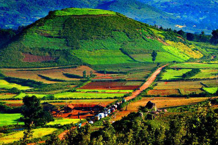 A breathtaking view of the Araku Valley landscape with multicolored pastures