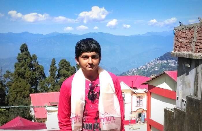 Balasubramanian posing in the backdrop of Darjeeling Hills