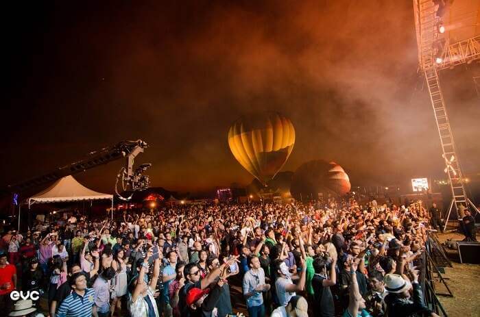 Crowd cheering at Enchanted Valley Carnival in Pune