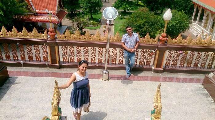 Apurva and her husband in a Buddhist temple in Bangkok