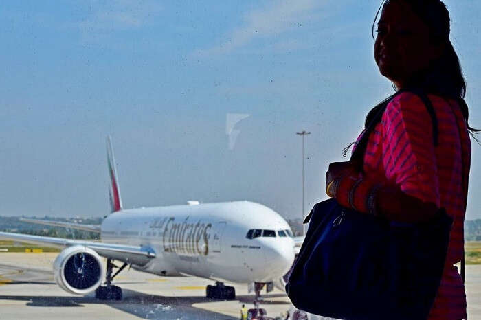 Yatins wife posing in the Maldives Airport