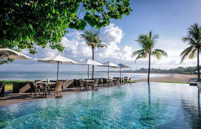 The pool adjacent to the beach at the Bali Garden Beach Resort at Kuta