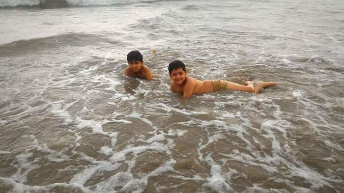 Kids enjoying swimming at the beach