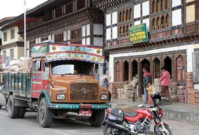 A view of shopkeepers unloading from the trucks on the Main Street at Paro