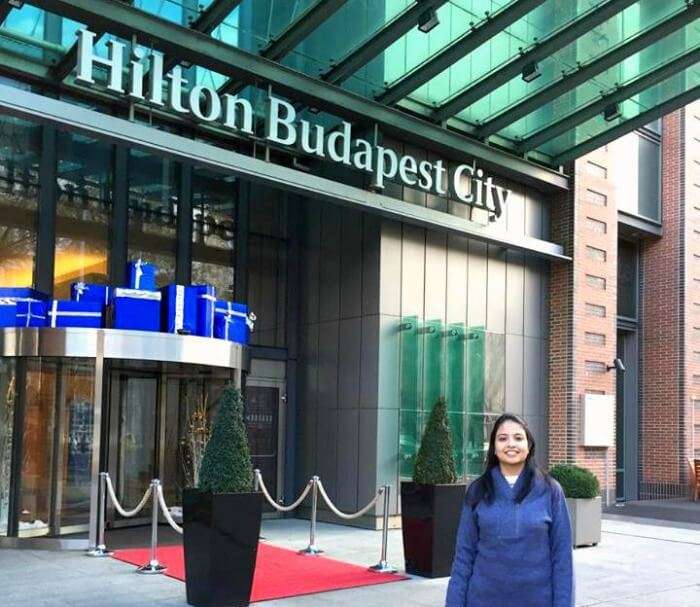 Posing with the Hilton Hotel in Budapest