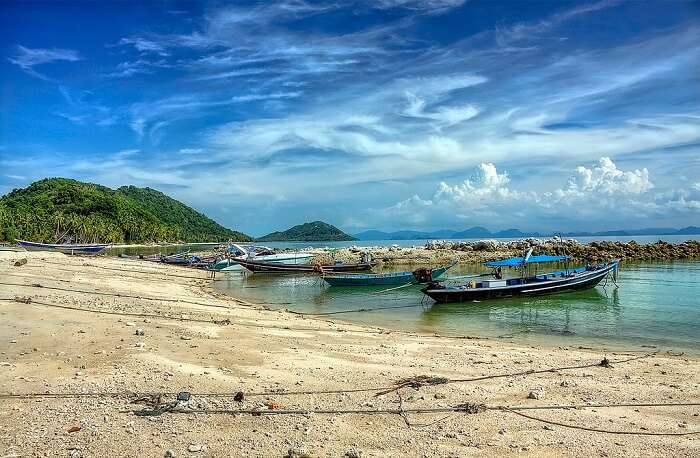 Fishing boats at the seashore of Taling Ngam Beach