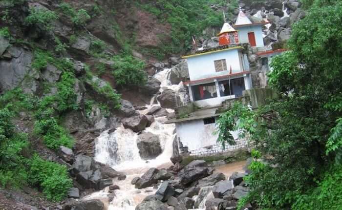 Badolia Baba Temple with a beautiful waterfall backdrop
