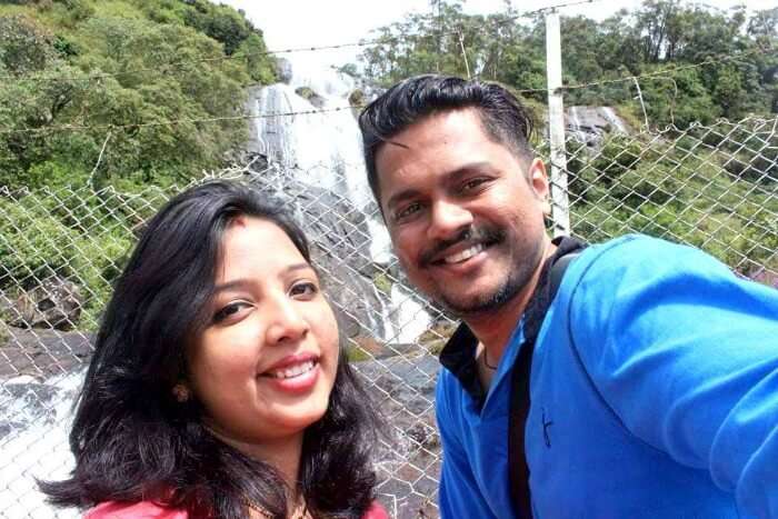 Yateen with his wife enjoying the beautiful view of the waterfall in Kerala