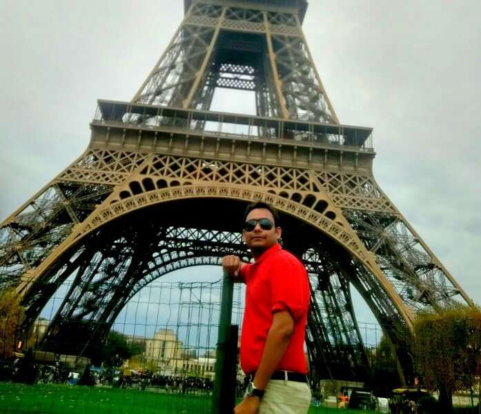 Niket below the Eiffel Tower in Paris
