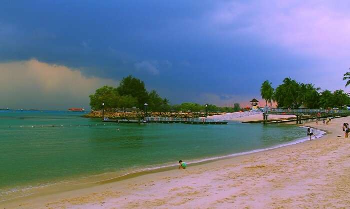 The beautiful tranquil expanse of Siloso Beach which is the most buzzing beach of Singapore