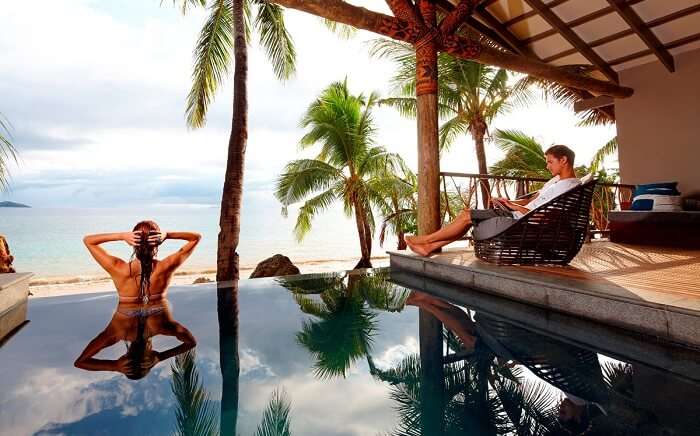 A couple relaxes in a private pool at the Tadrai Island Resort