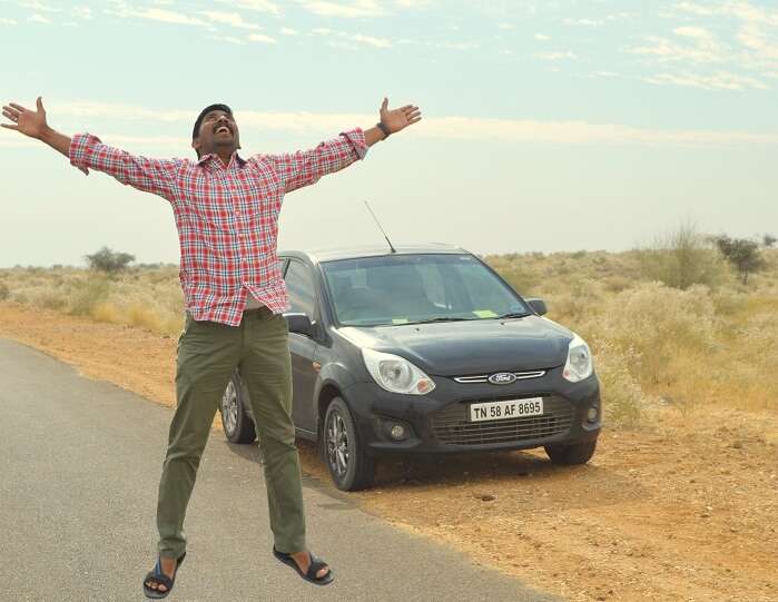 Arvind doing a jump on a highway in Rajasthan