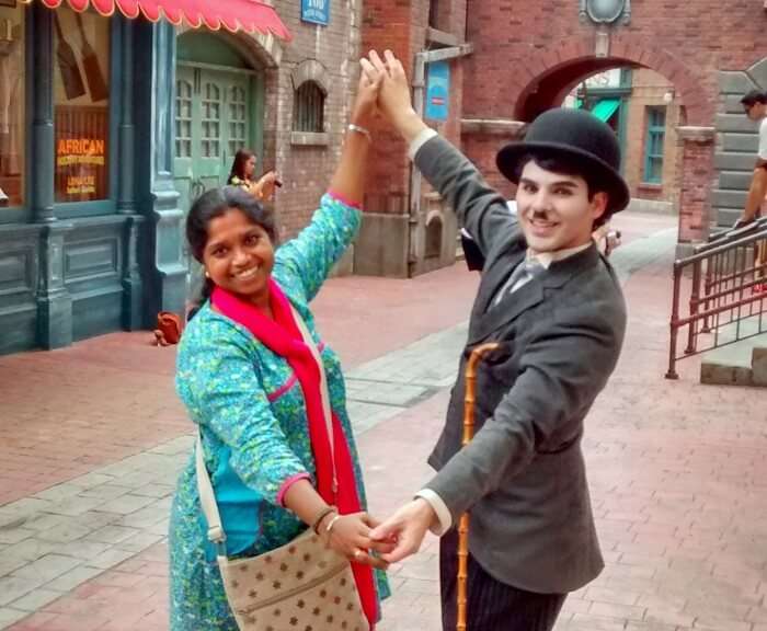Siva's wife dancing with the made-up Charlie Chaplin