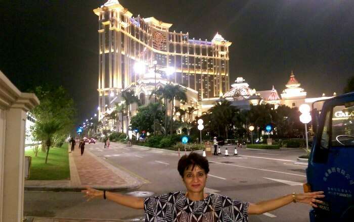 Posing in front of the gorgeously lit up Macau