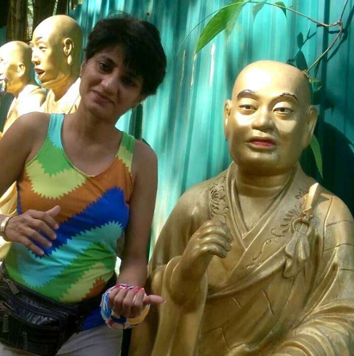 Enjoying a moment with the golden monk in Hong Kong