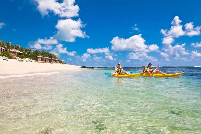 People canoeing at Poste Lafayette Beach in Mauritius