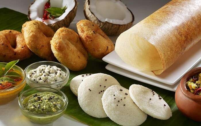 A South Indian thali with idli-vada-dosa and various chutneys