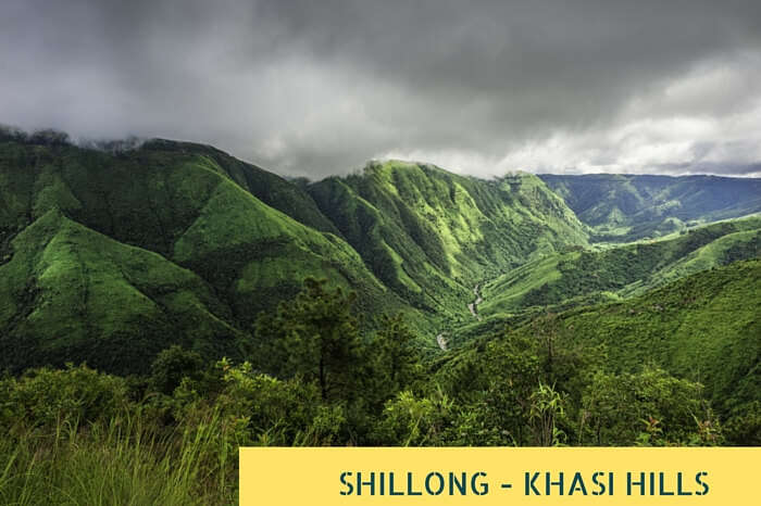 Storm clouds gather over the Khasi Hills as dawn breaks over the deep valley gorges near Shillong