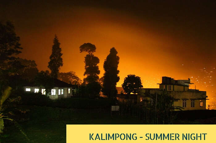 Lights of the guest house create an orange blanket after reflecting from the misty clouds at Kalimpong