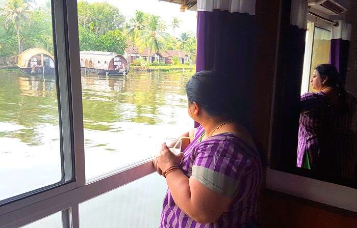 Mohan's wife admiring the view from the houseboat