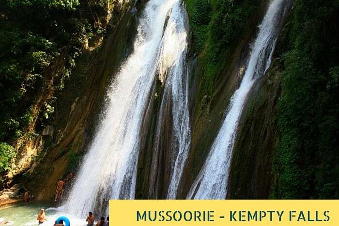 Tourists taking bath at the famous Kempty Waterfalls near Mussoorie during summer holidays in India