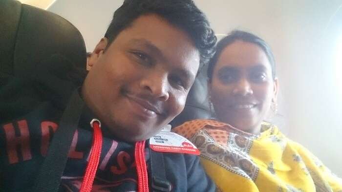 Naveen and his wife click a selfie inside the plane