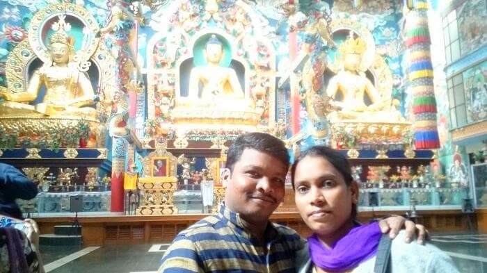 Naveen and his wife in a monastery